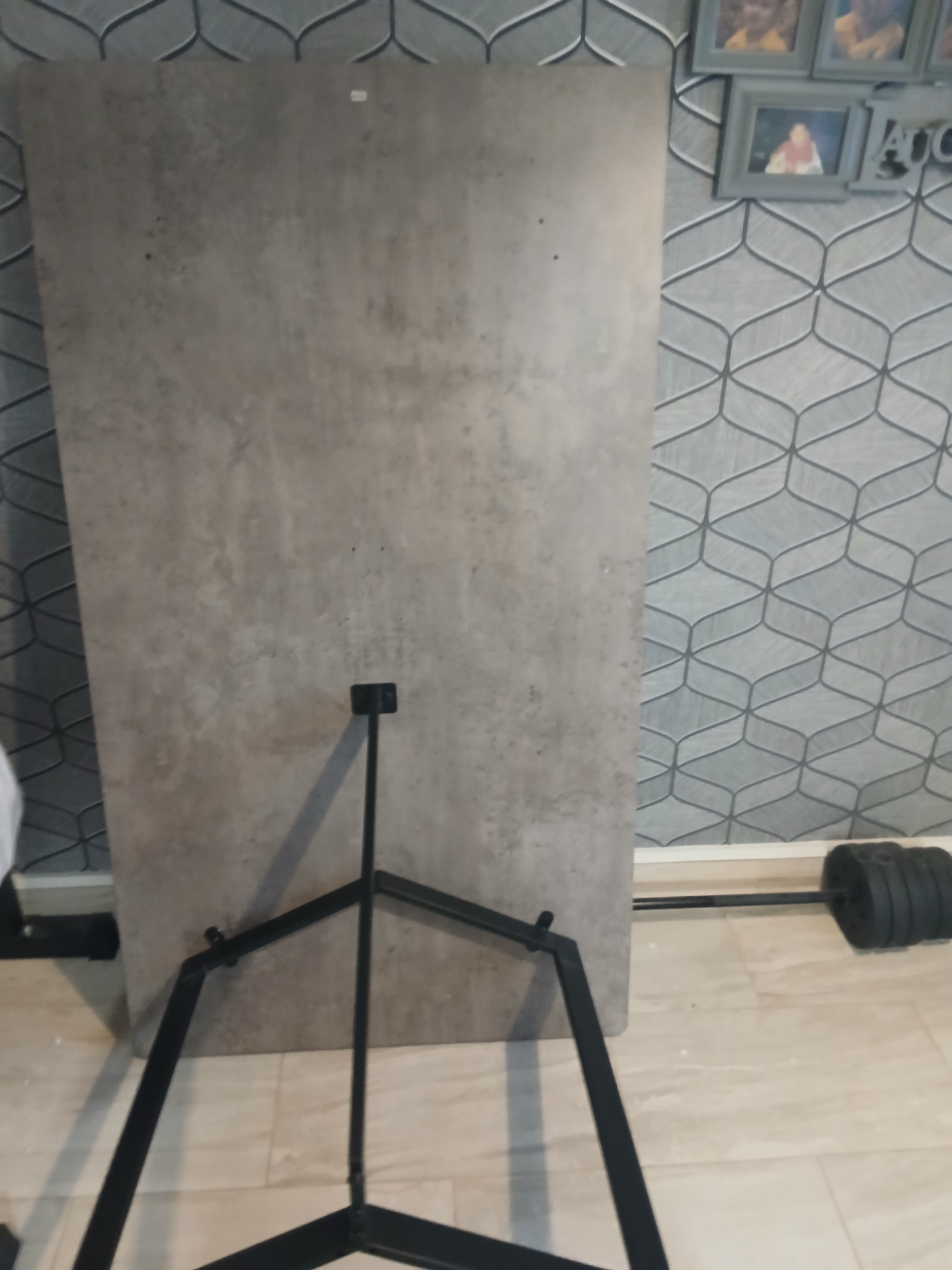 Concrete-effect dining table in Cardiff — top and legs unpacked