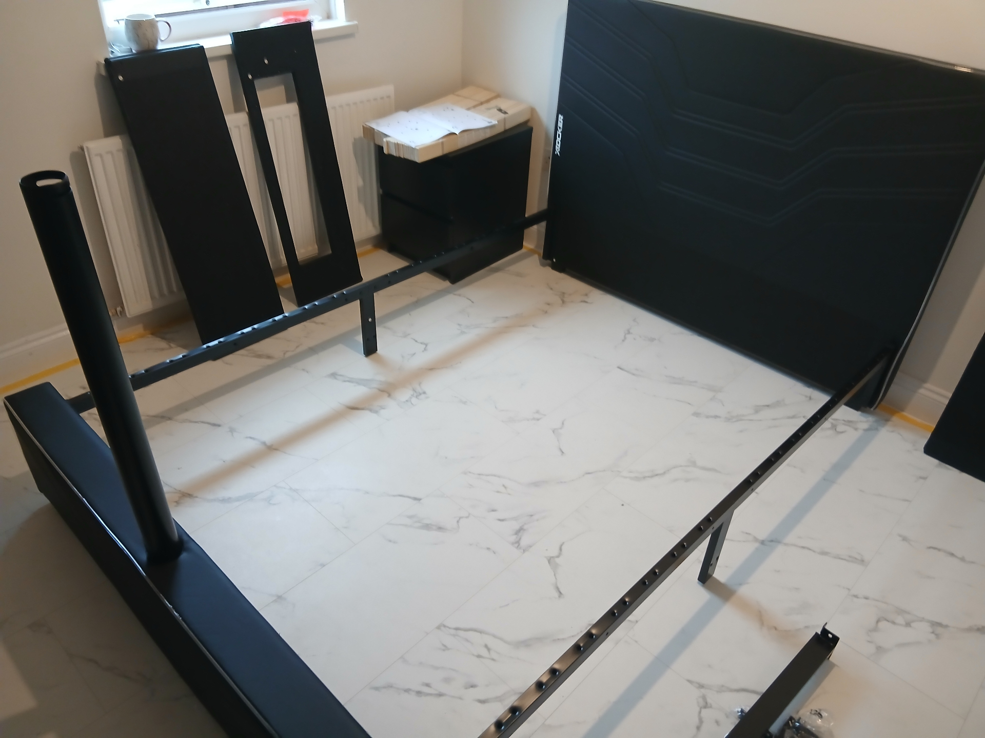 Gaming bed frame & TV mount in Cardiff — flat-pack laid out